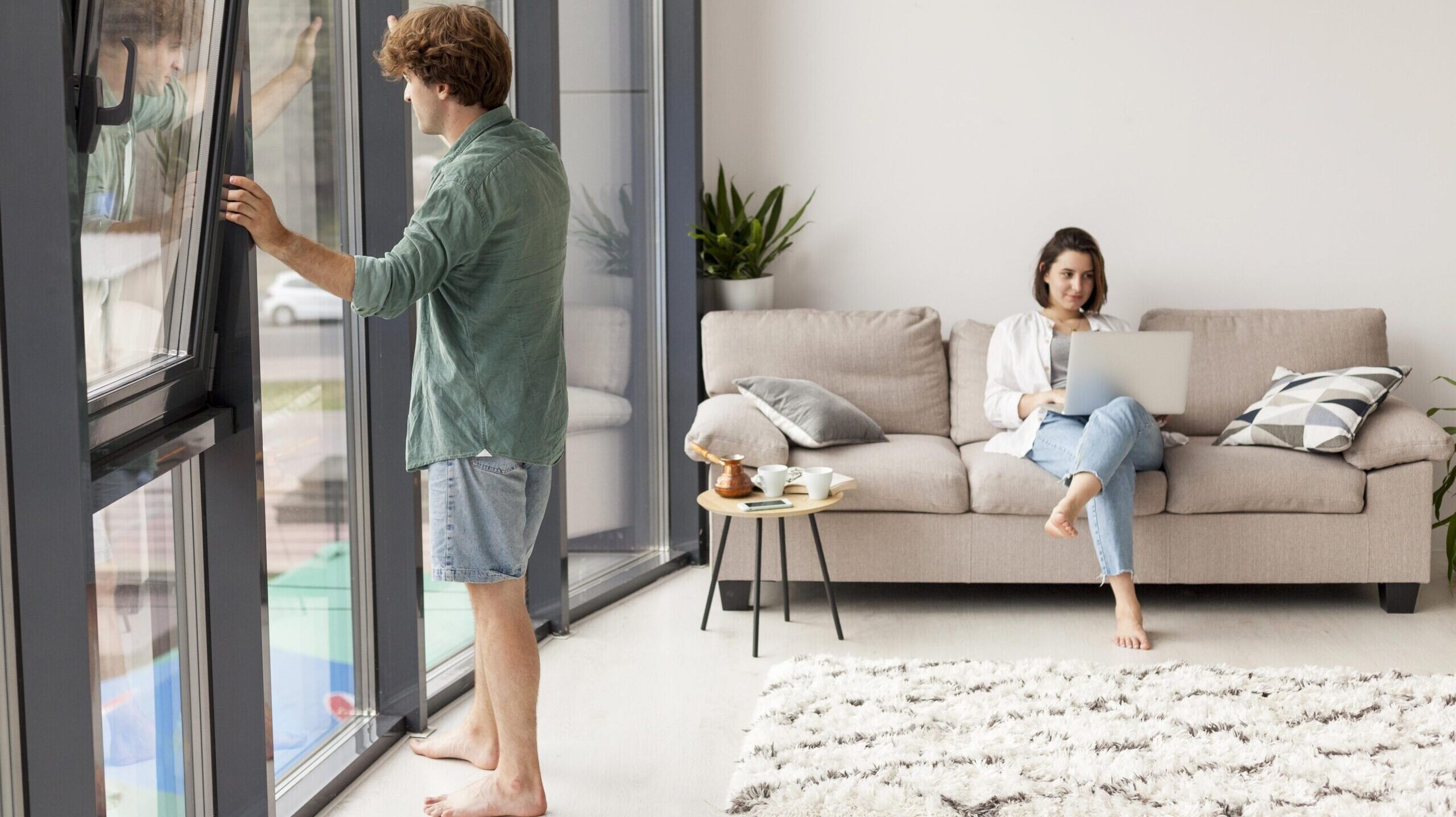 full shot couple living room scaled e1754732225586